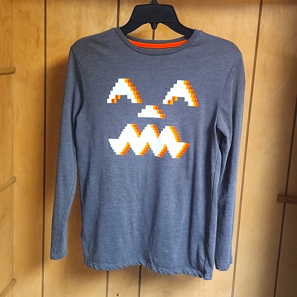 Grey Halloween themed shirt with jack o lantern pattern. Size Girls 12/14.